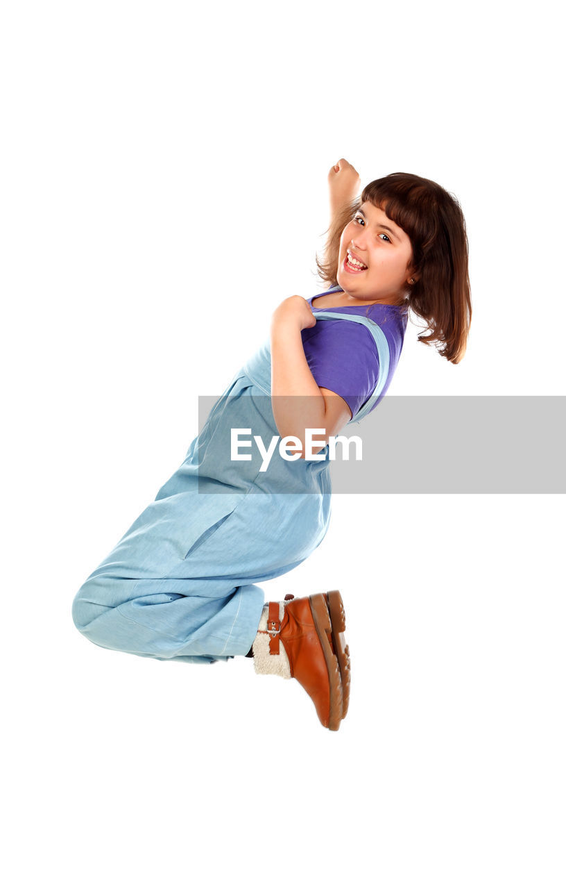 SIDE VIEW OF A GIRL AGAINST WHITE BACKGROUND