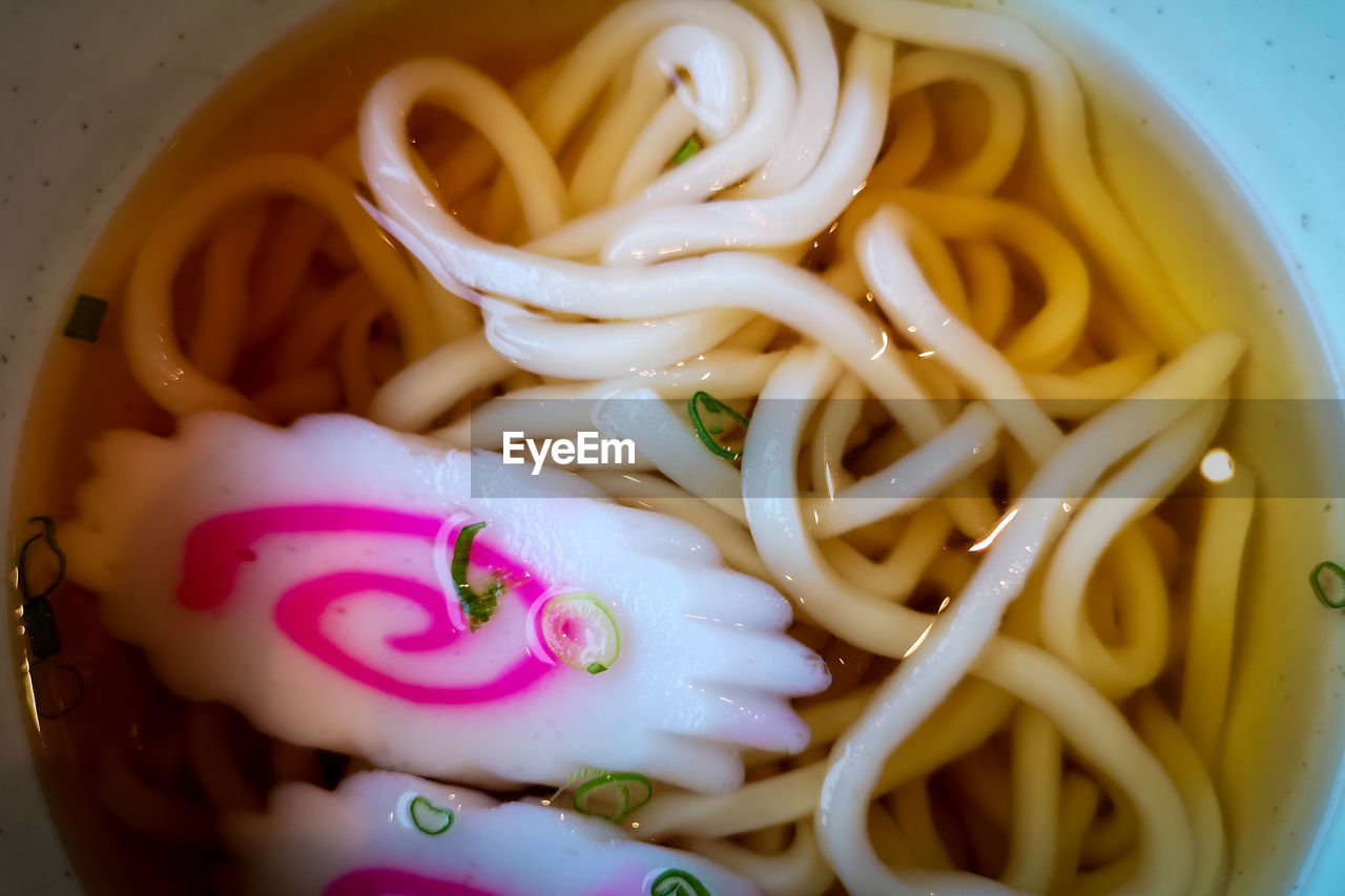 HIGH ANGLE VIEW OF PASTA WITH PINK AND SAUCE