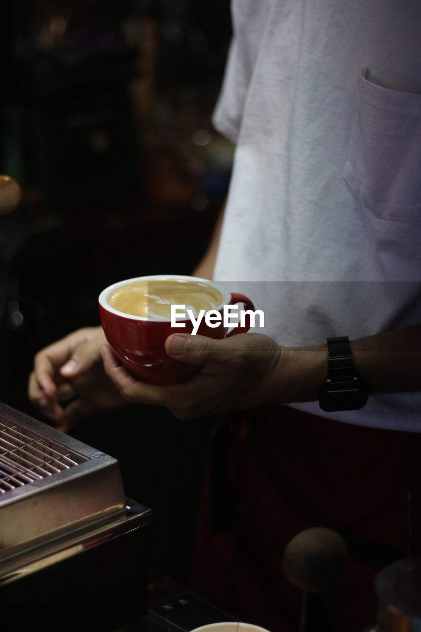 Man holding latte art