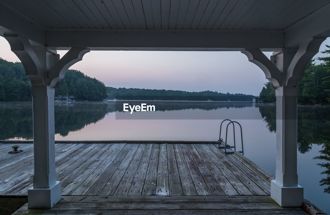 VIEW OF SWIMMING POOL BY LAKE