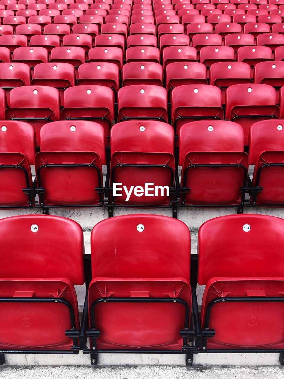 FULL FRAME SHOT OF EMPTY CHAIRS IN STADIUM