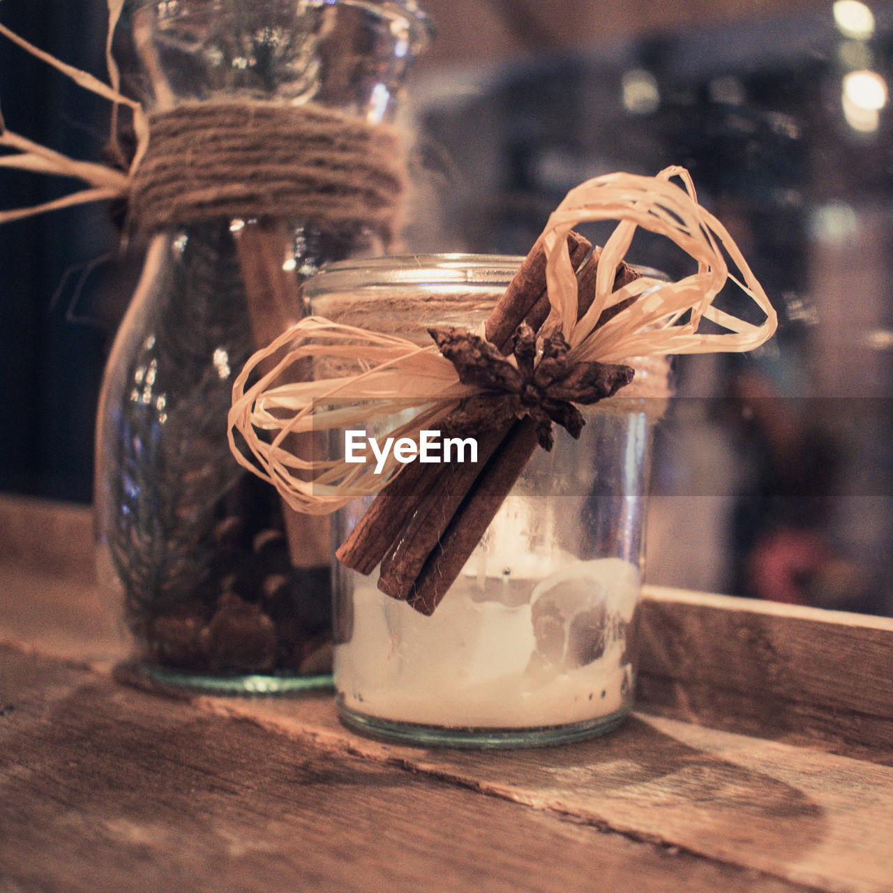 CLOSE-UP OF JAR ON TABLE