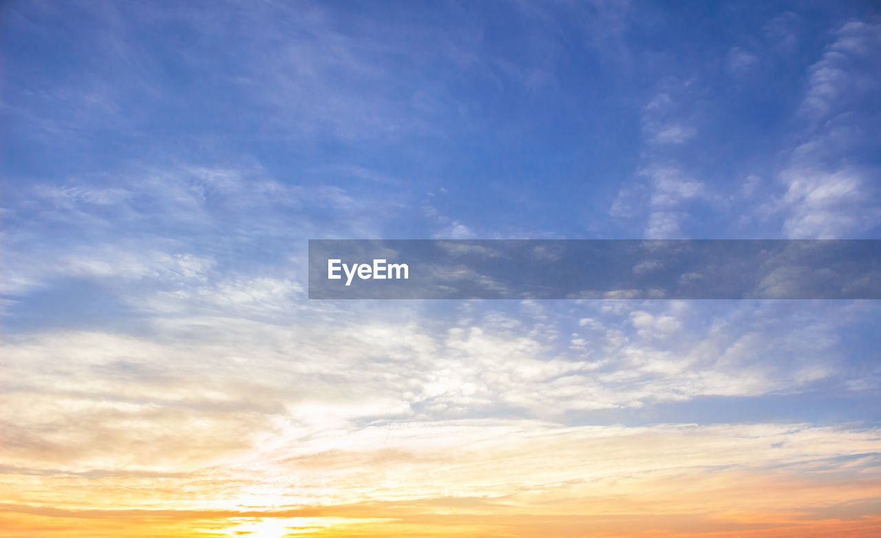 LOW ANGLE VIEW OF CLOUDY SKY AT SUNSET