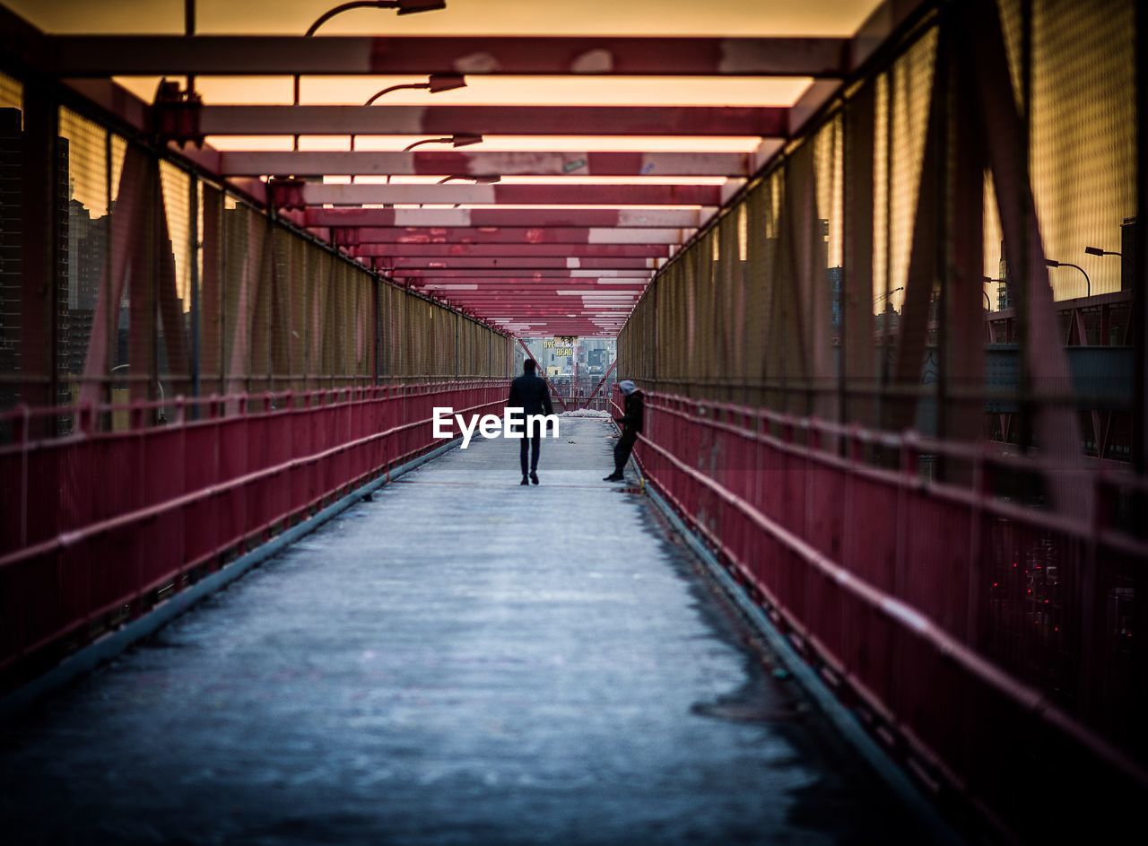 People walking on footbridge