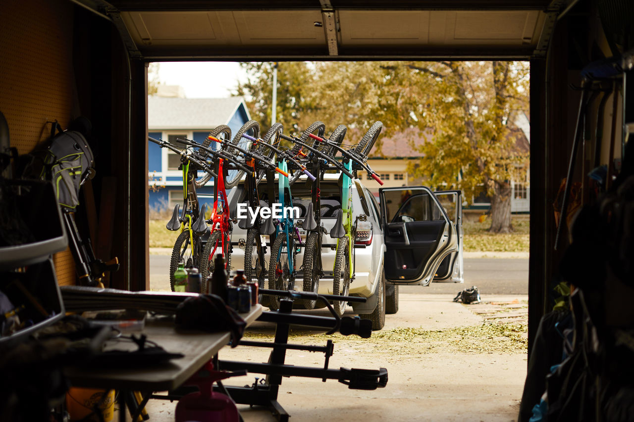 A six bike rack full of mountain bikes and ready to go.
