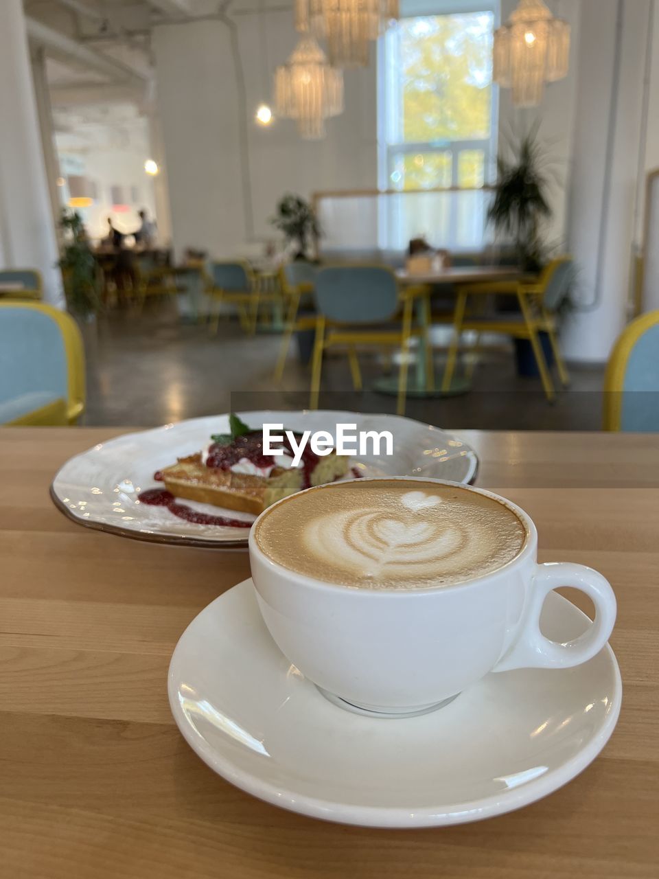 indoors, lighting, domestic room, home, home interior, no people, tableware, food and drink, room, table, cup, focus on foreground, yellow, domestic life, household equipment, drink, porcelain, crockery, mug, business