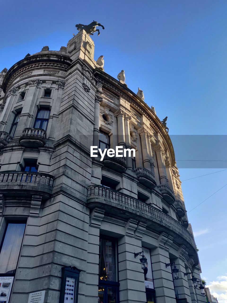 Low angle view of historical building against blue sky