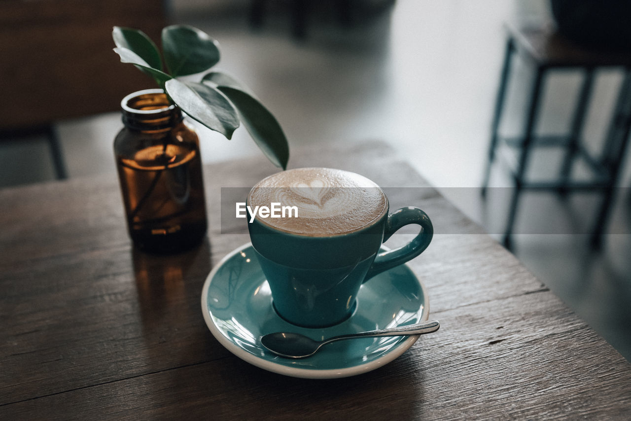 High angle view of coffee cup on table