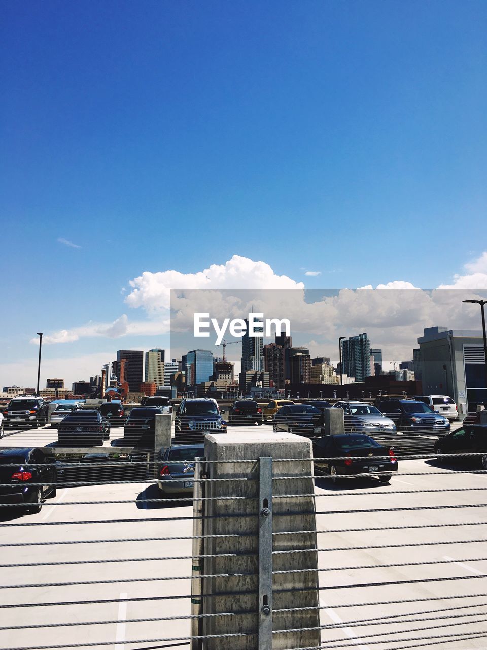 View of cityscape against blue sky