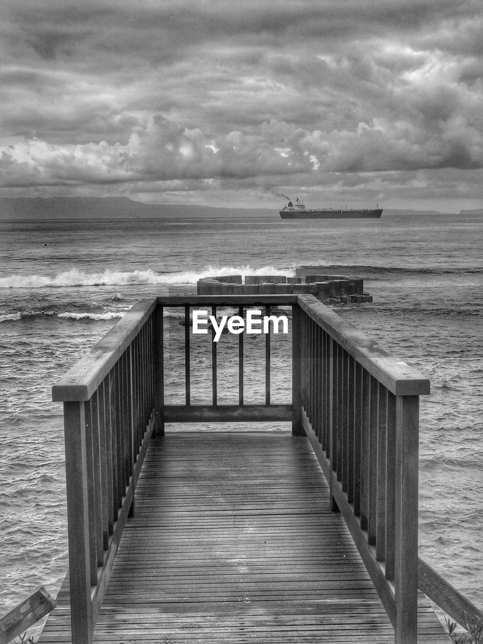 PIER ON SEA AGAINST SKY