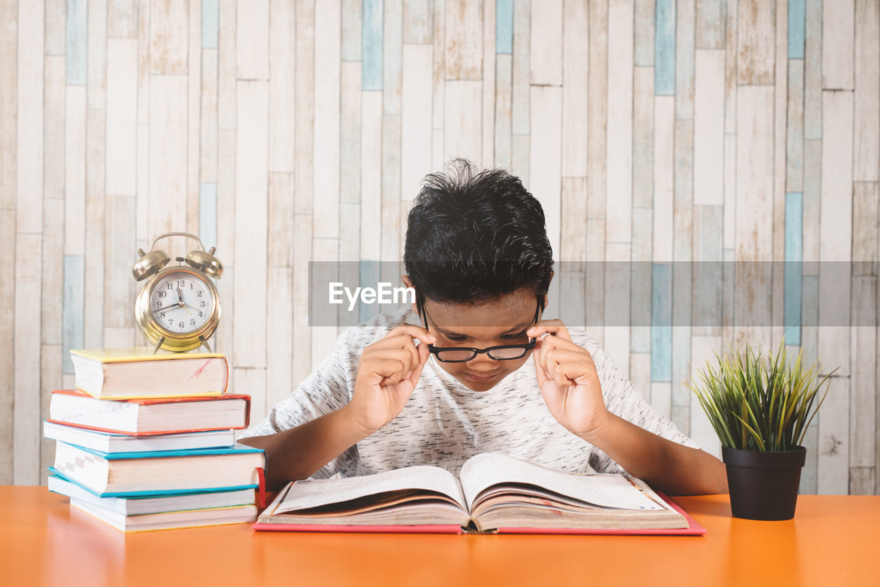 PORTRAIT OF MAN READING BOOK