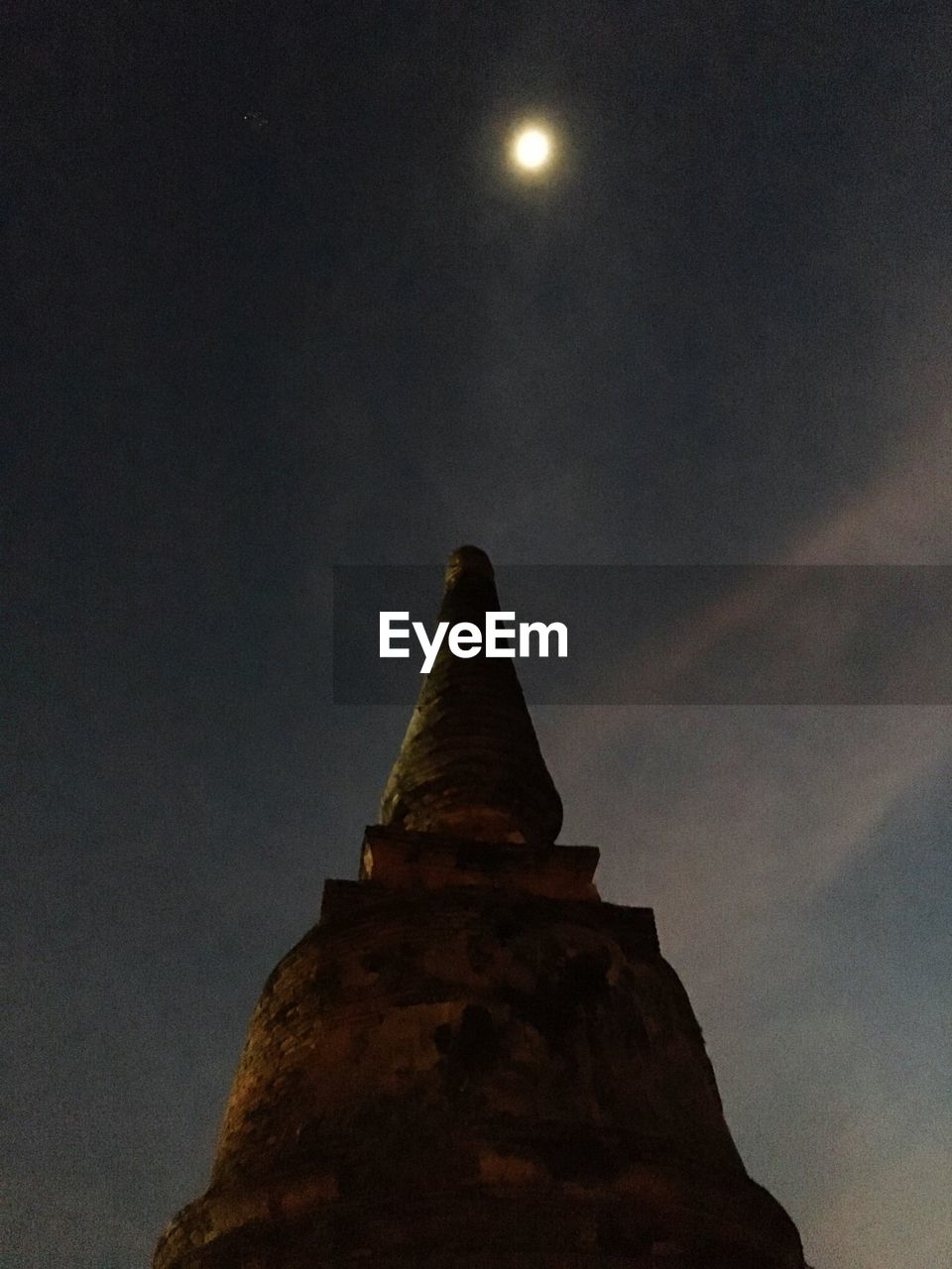 Low angle view of historic temple against sky at night