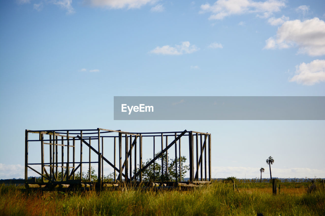 sky, horizon, nature, grass, cloud, architecture, plant, land, landscape, day, built structure, rural area, field, outdoors, environment, no people, morning, prairie, blue, copy space, scenics - nature