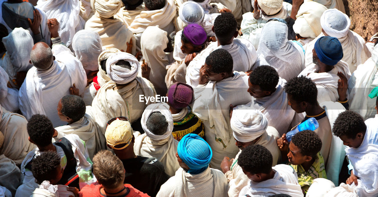 HIGH ANGLE VIEW OF GROUP OF PEOPLE ON THE FLOOR