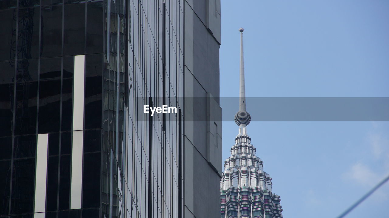 LOW ANGLE VIEW OF BUILDINGS AGAINST SKY