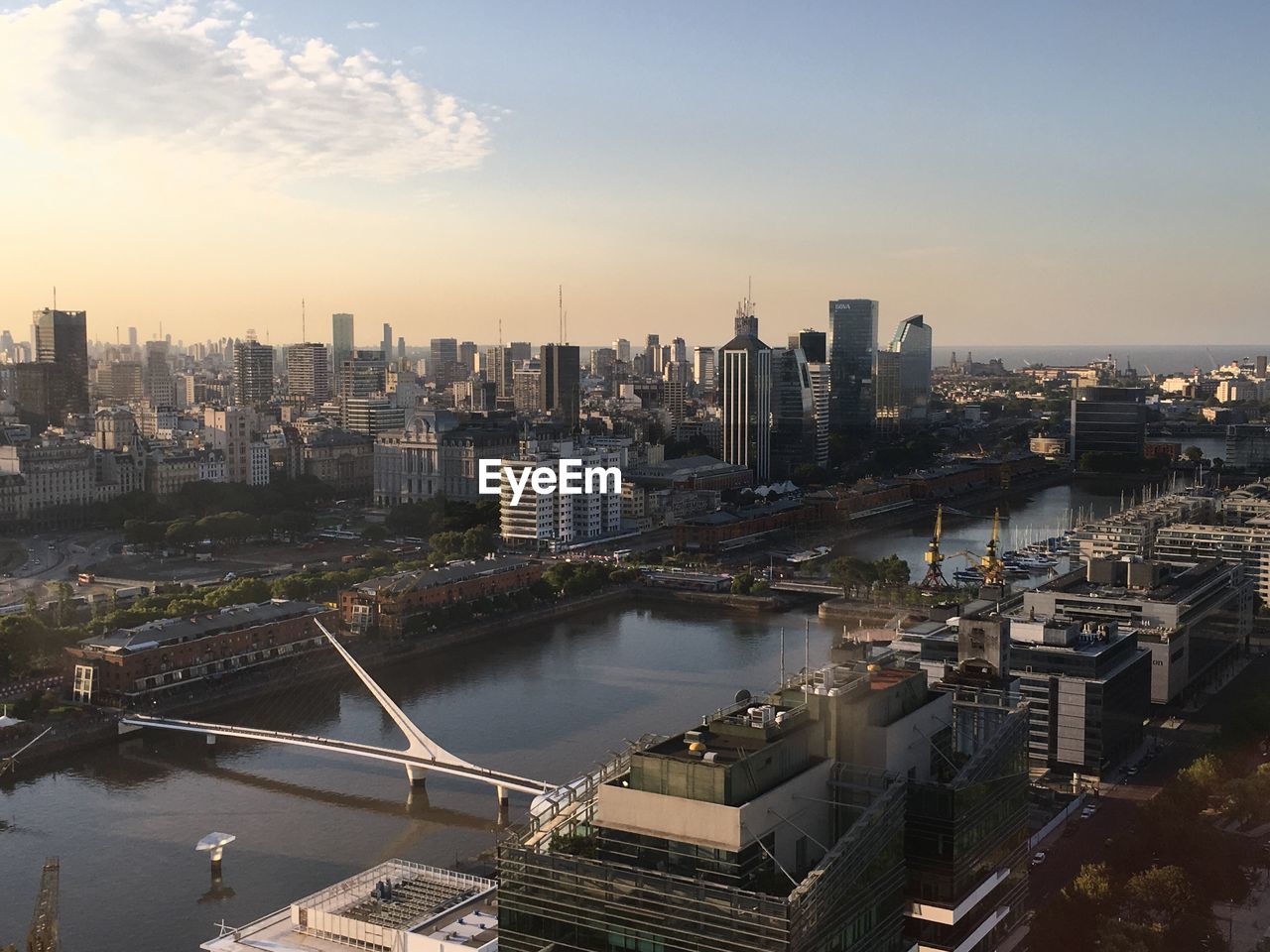 High angle view of river amidst buildings against sky