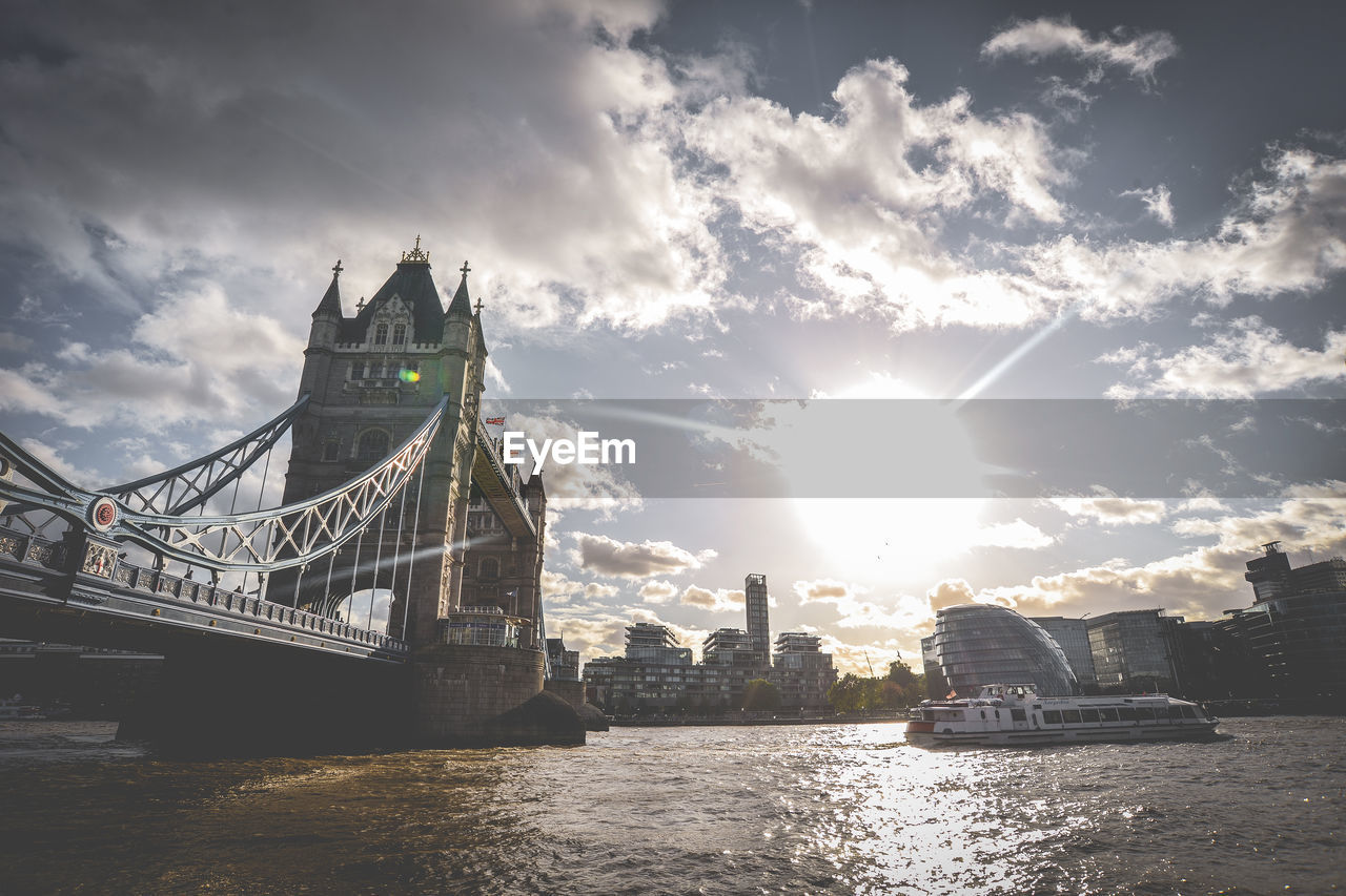 View of bridge over river against cloudy sky