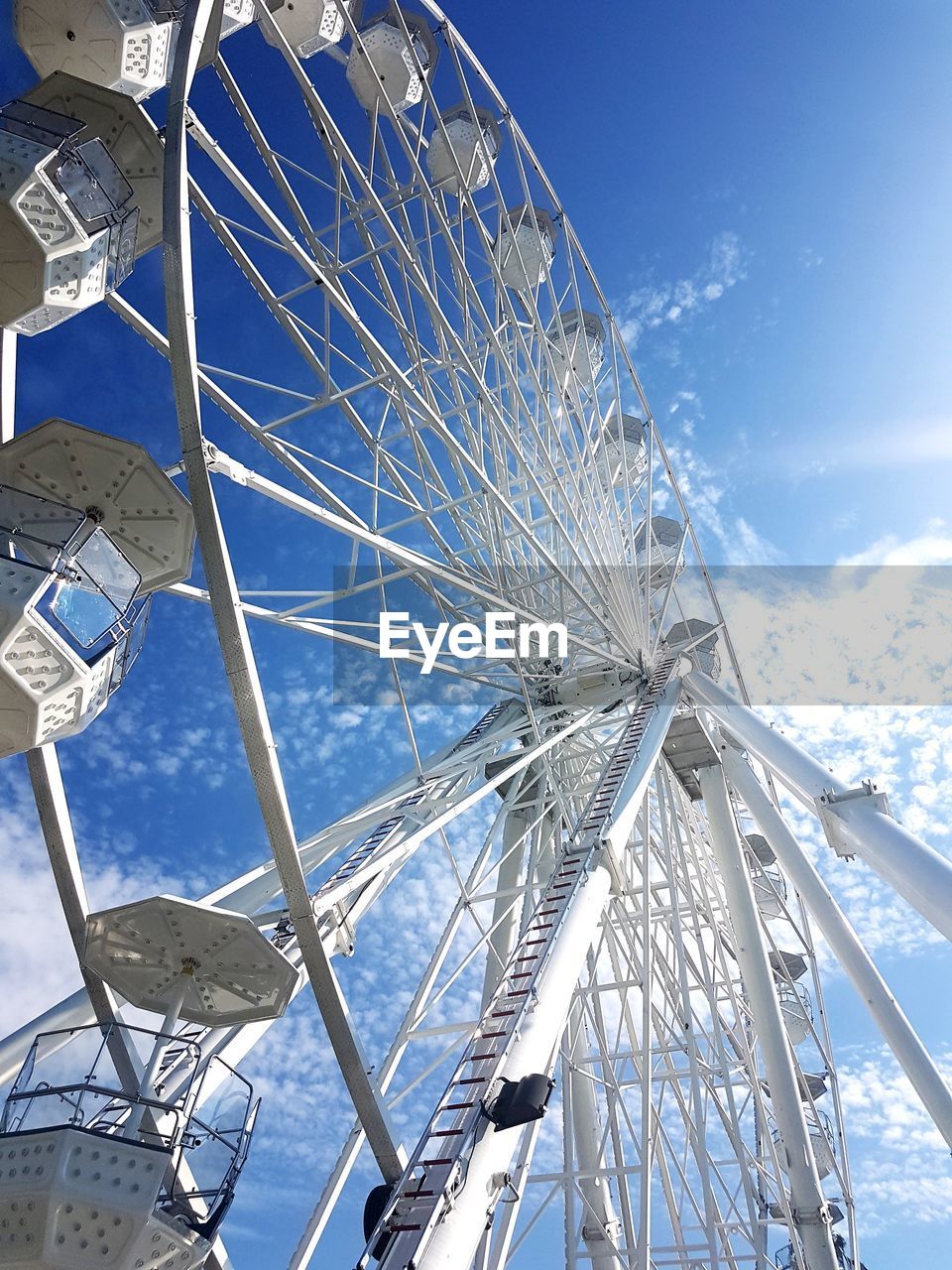 LOW ANGLE VIEW OF AMUSEMENT PARK AGAINST SKY