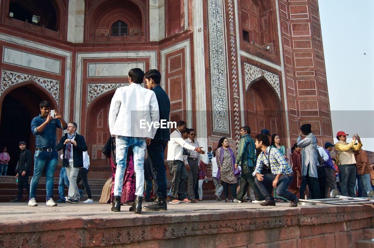 Tourists by historic building