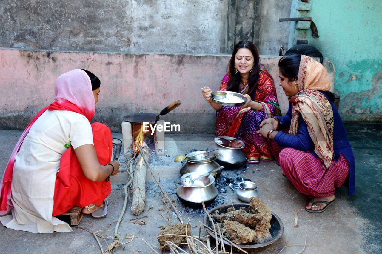 Women preparing food on terrace