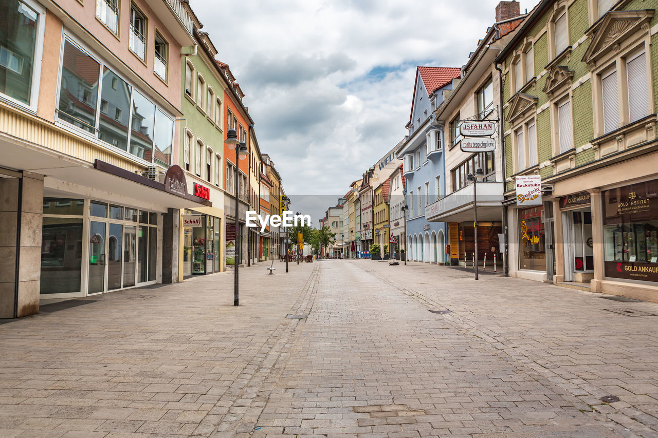 EMPTY ROAD ALONG BUILDINGS