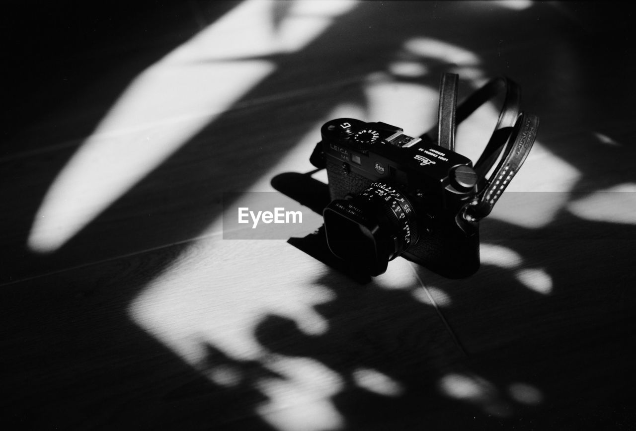 High angle view of camera on hardwood floor