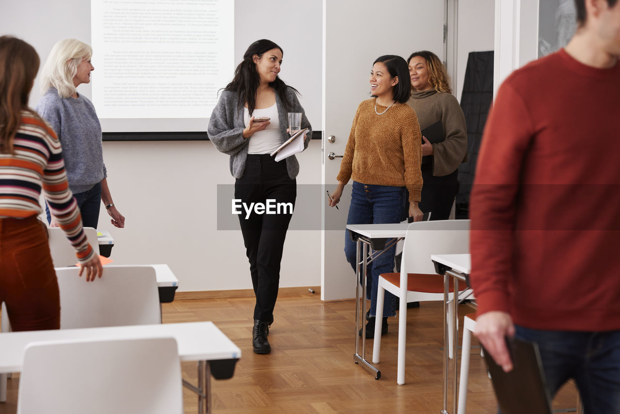 People entering meeting room