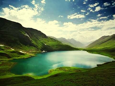 SCENIC VIEW OF MOUNTAINS AGAINST CLOUDY SKY