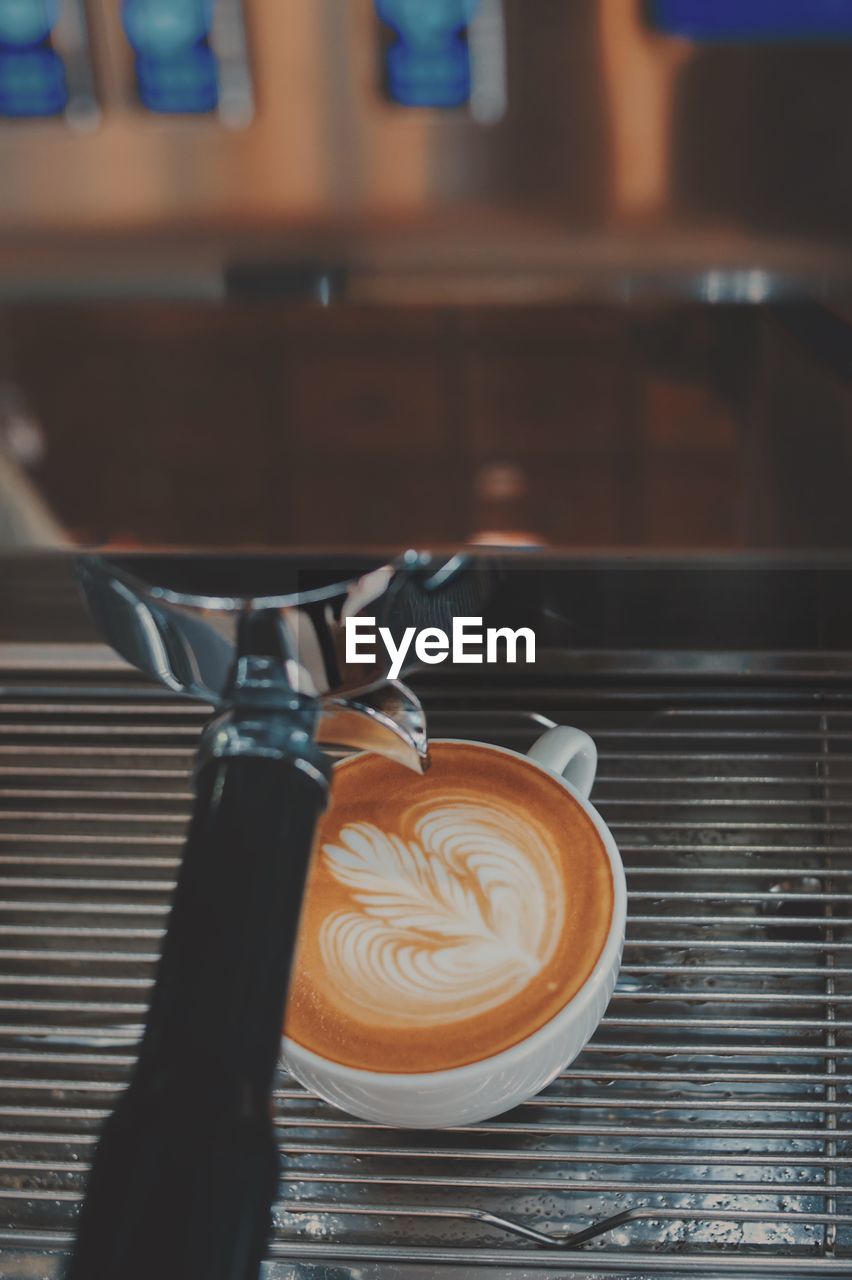 Coffee cup on espresso maker