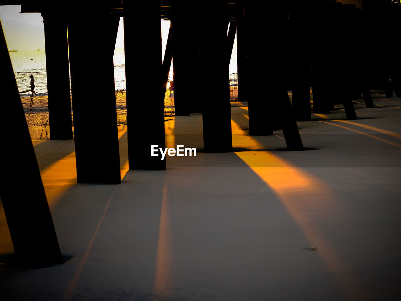 VIEW OF ILLUMINATED EMPTY CORRIDOR