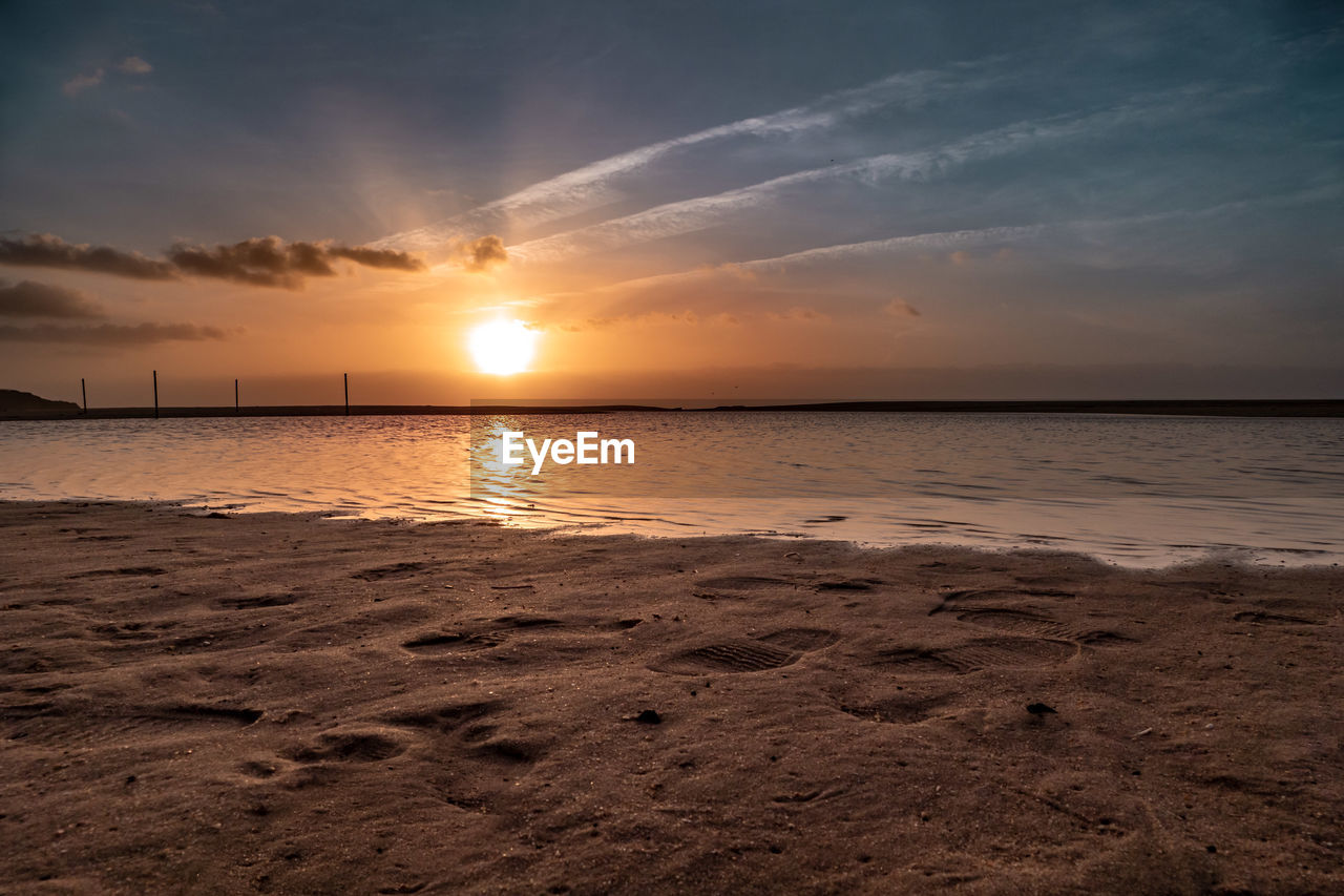 Scenic view of sea against sky during sunset