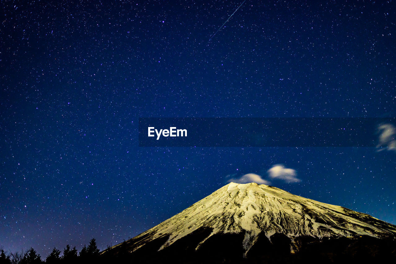 Low angle view of star field against sky at night