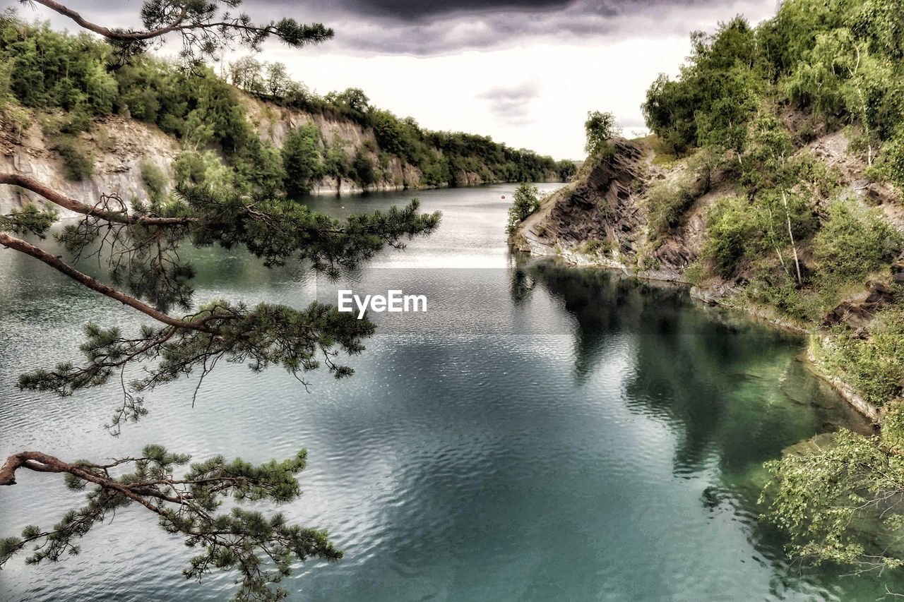 SCENIC VIEW OF RIVER BY TREES AGAINST SKY