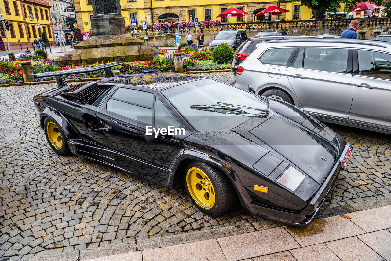 CARS PARKED ON STREET IN CITY