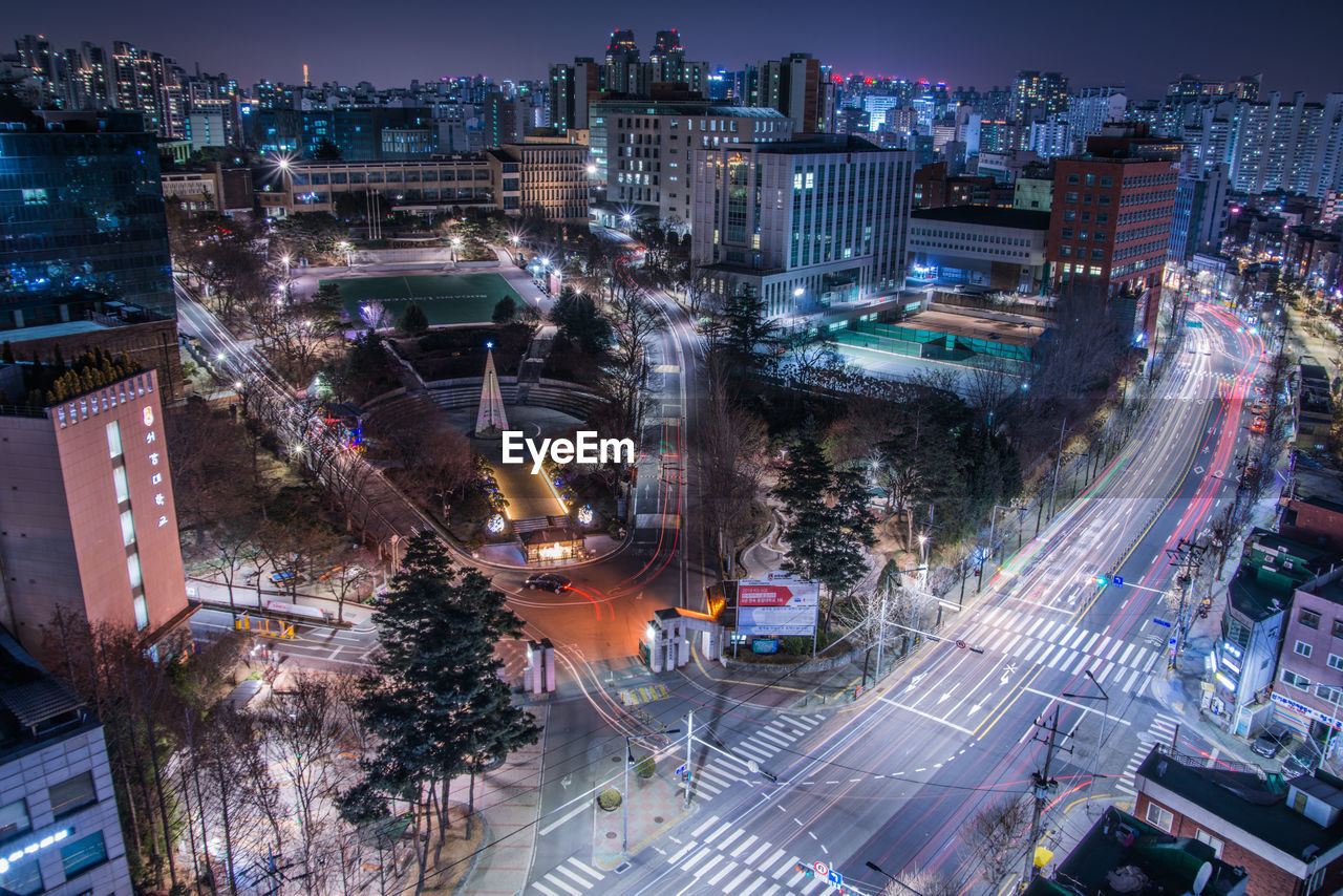 High angle view of illuminated cityscape at night