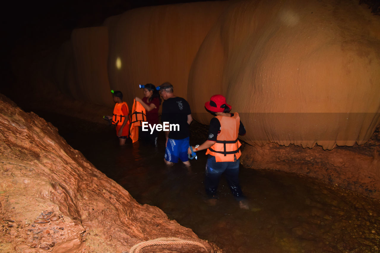 People walking in cave