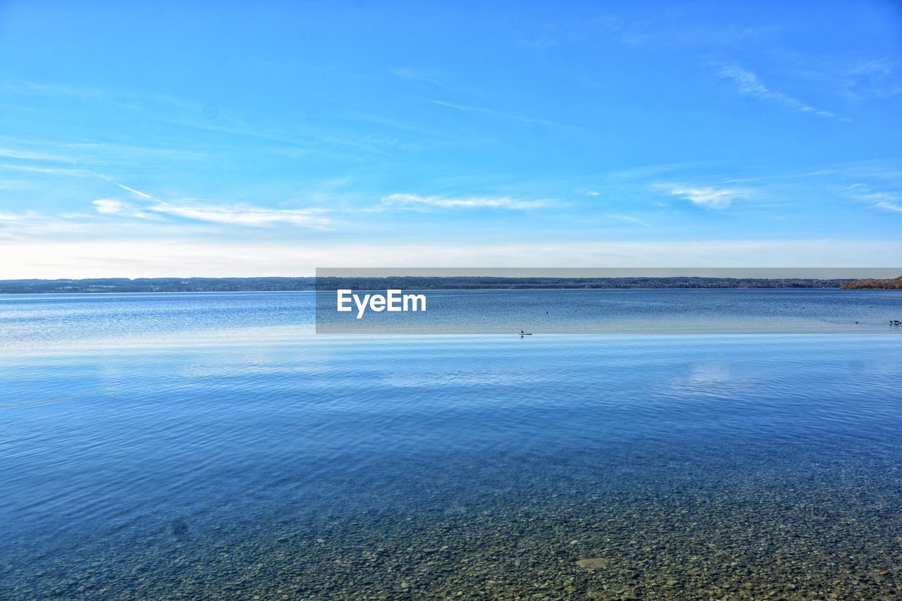 Scenic view of sea against blue sky