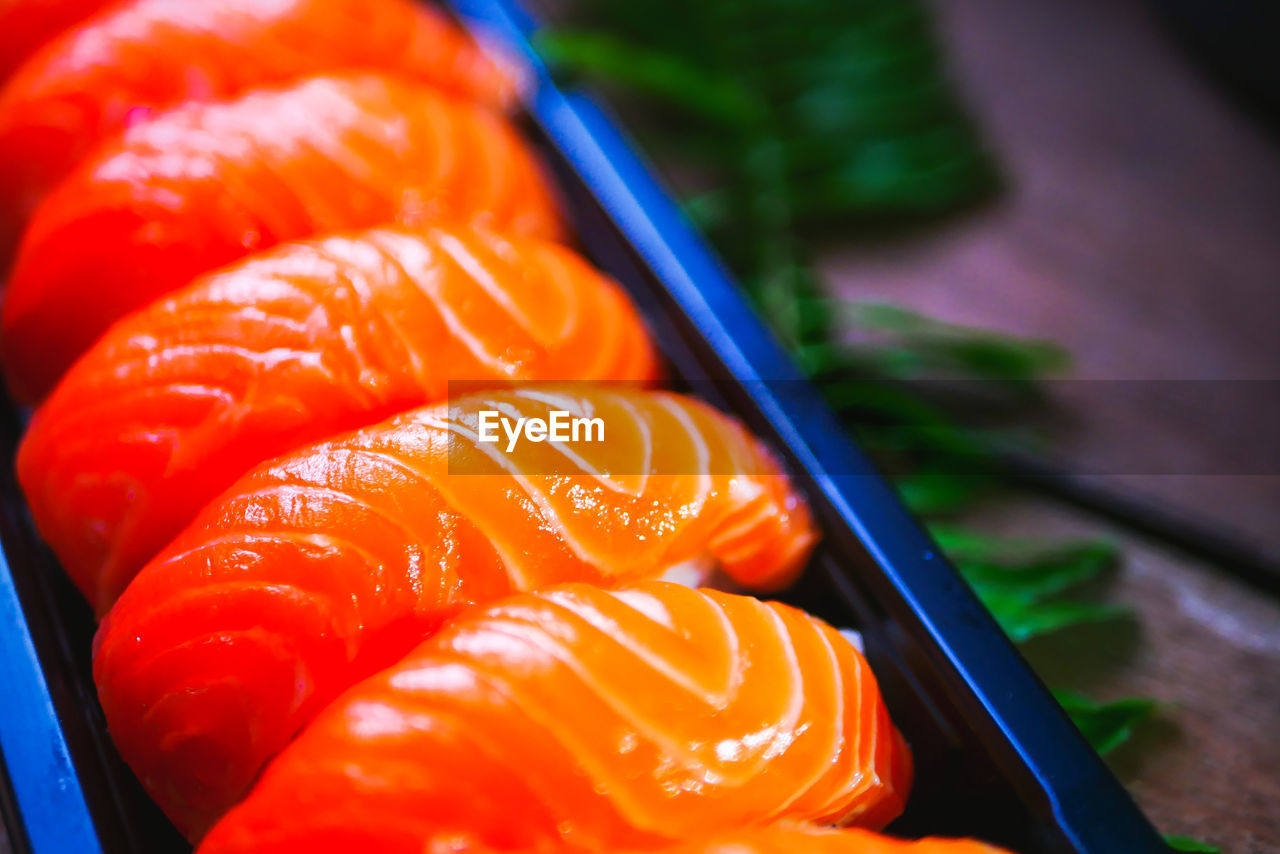 CLOSE-UP OF ORANGE FISH IN MARKET