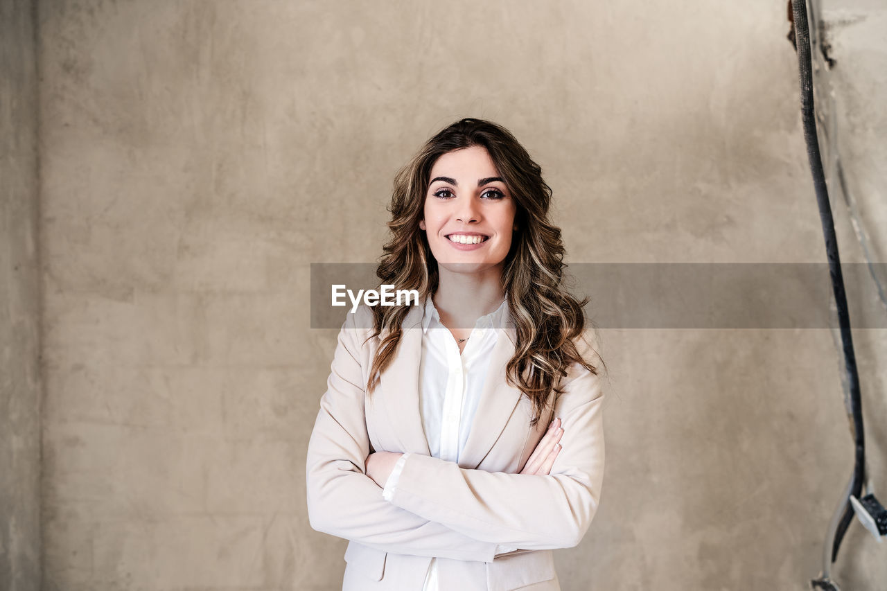 Smiling professional confident architect woman in construction site. home renovation