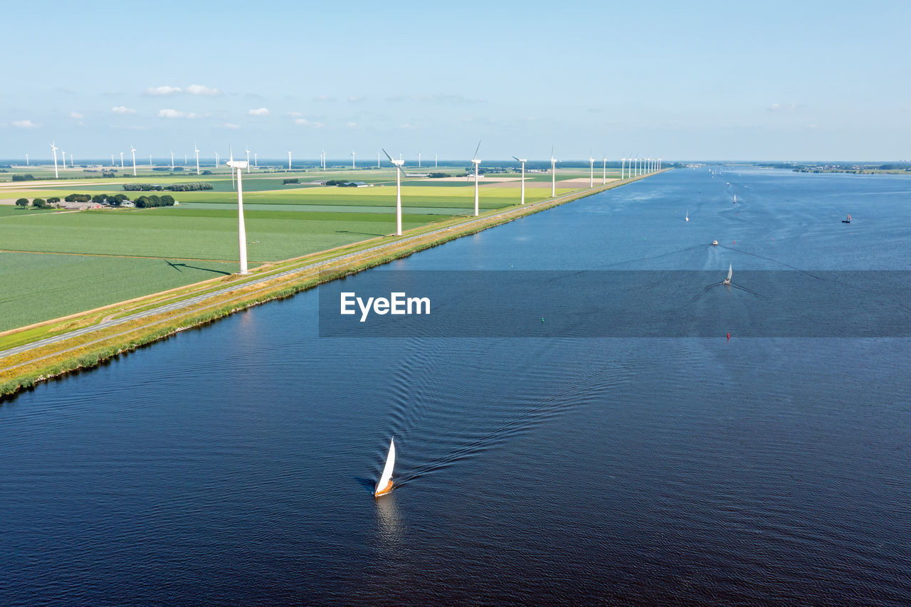 Aerial from sailing on the eenmeer with windmills in the netherlands