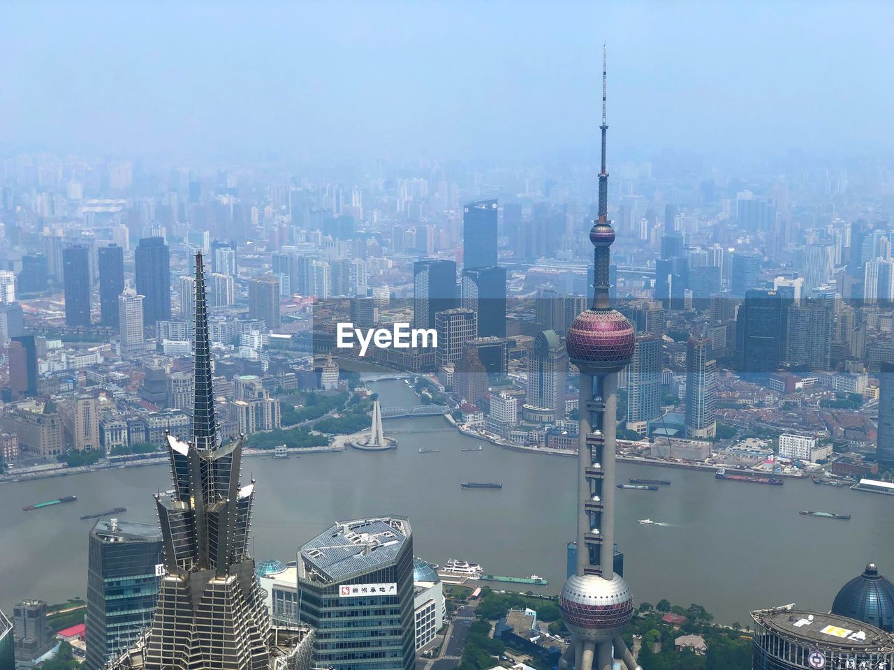 AERIAL VIEW OF CITY BUILDINGS AGAINST SKY