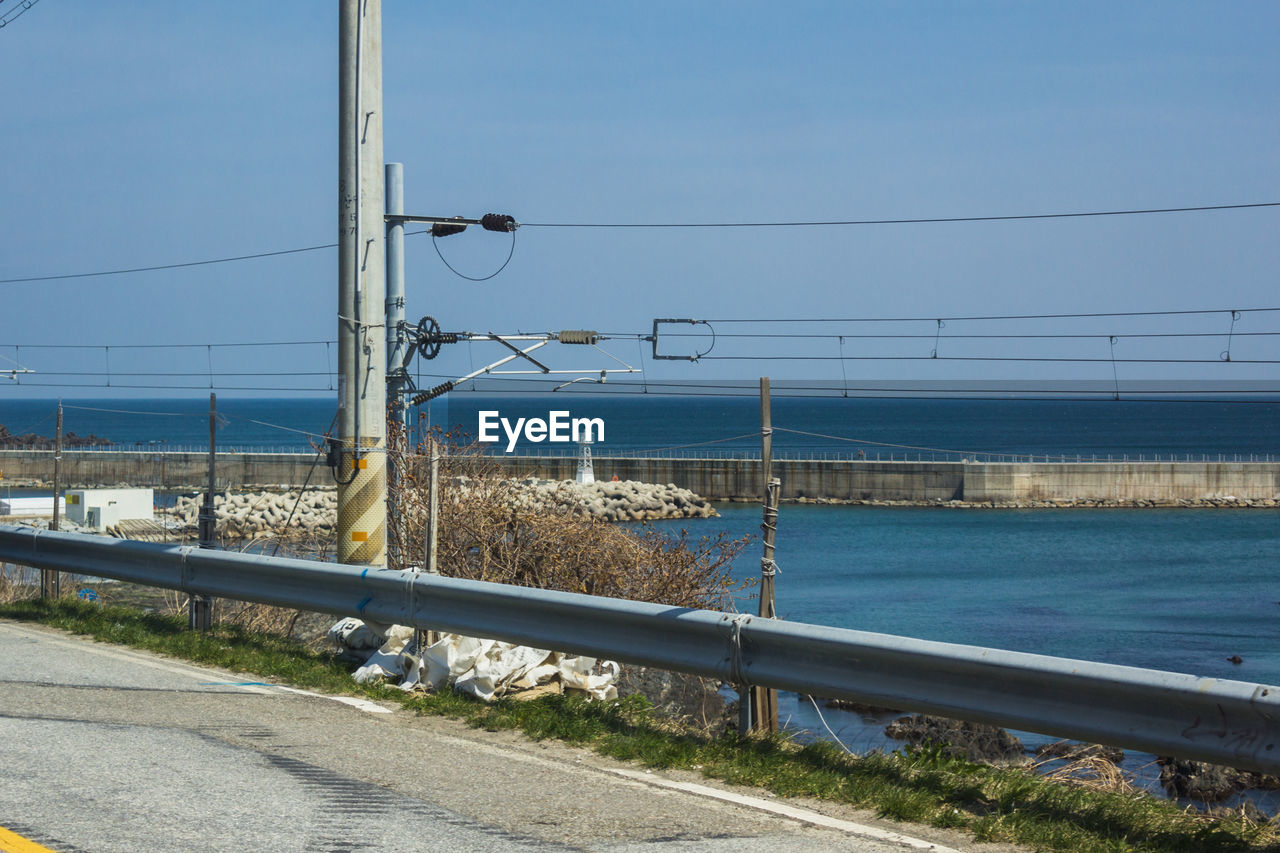 ROAD BY SEA AGAINST SKY