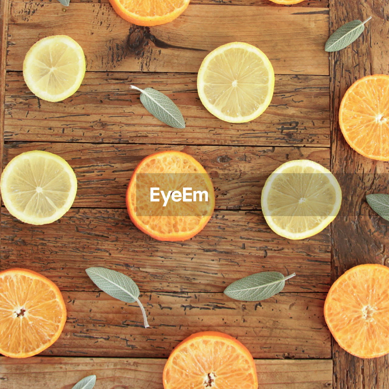 High angle view of orange slices on wooden table