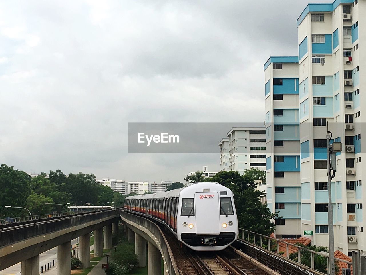 TRAIN IN CITY AGAINST SKY