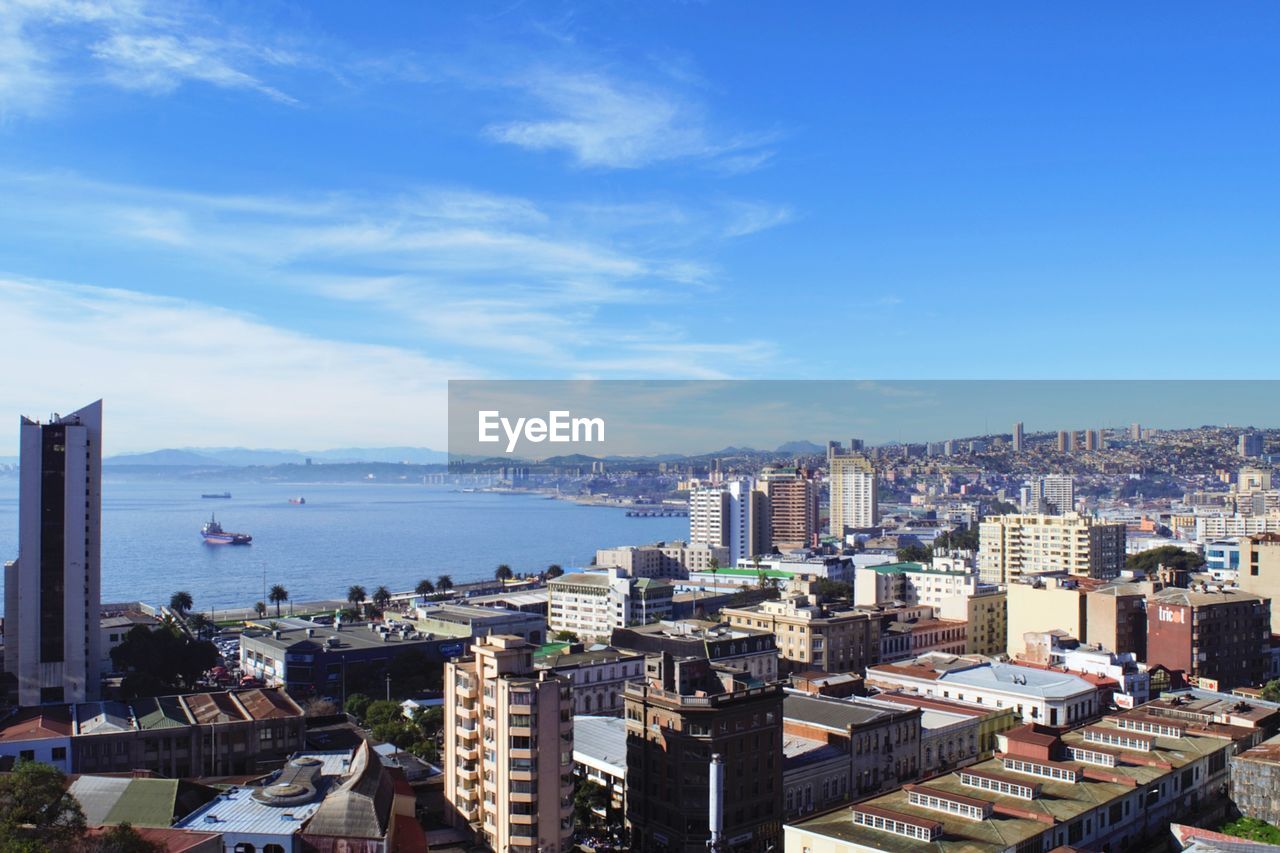 HIGH ANGLE VIEW OF BUILDINGS AGAINST SKY