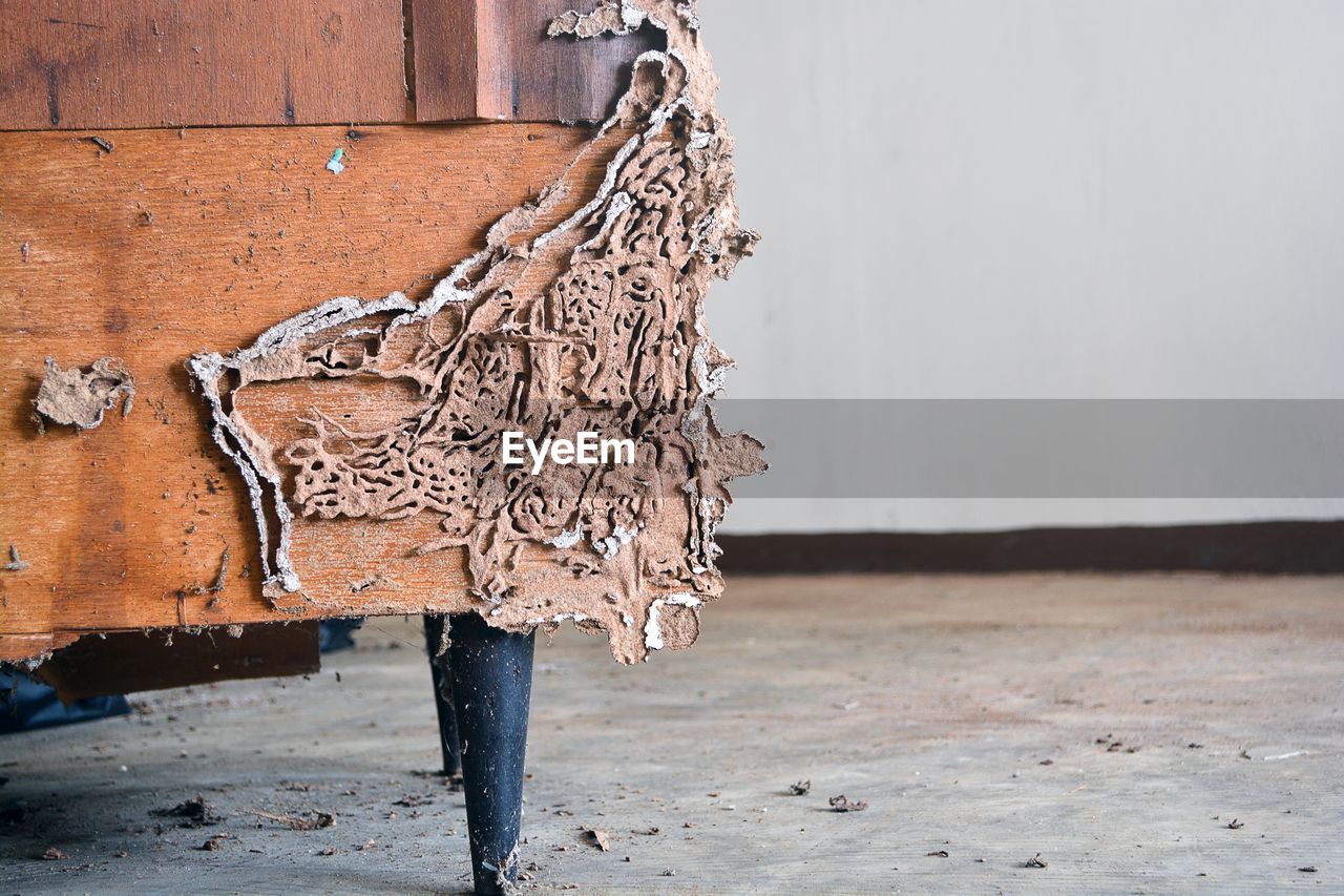 Close-up of weathered sofa at home