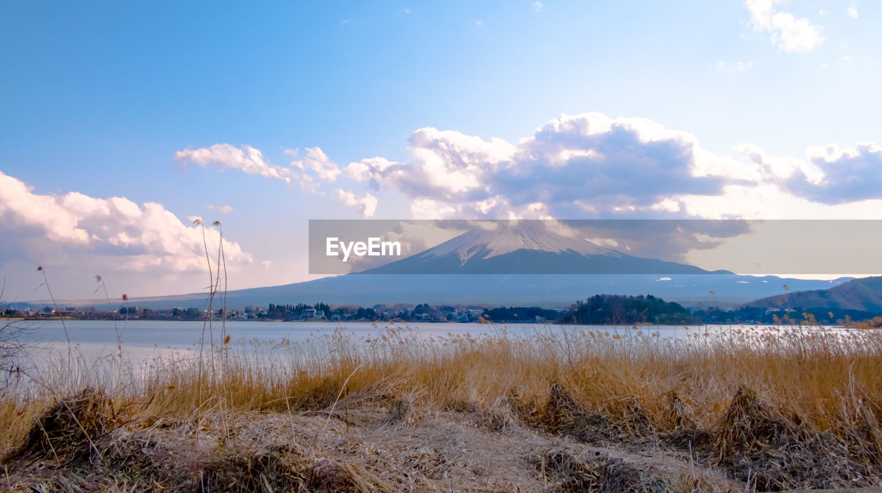 SCENIC VIEW OF MOUNTAINS AGAINST SKY DURING WINTER