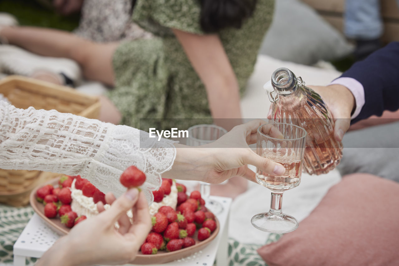 Pouring drink into wineglass