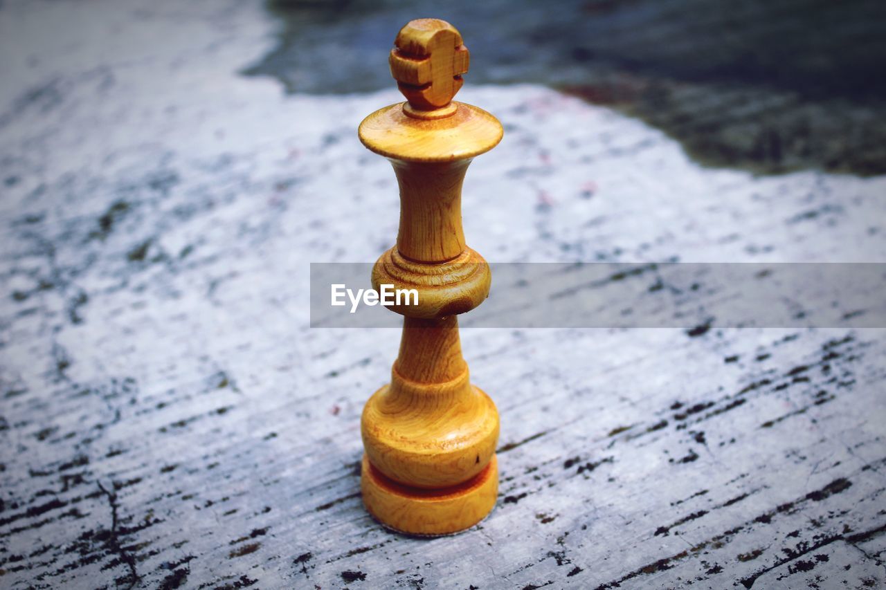 Close-up of chess piece on marble