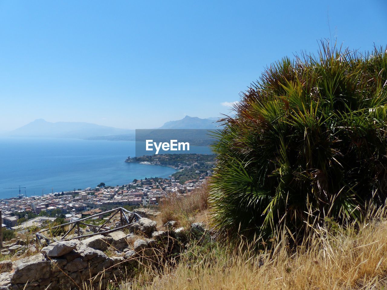 Scenic view of sea against clear blue sky